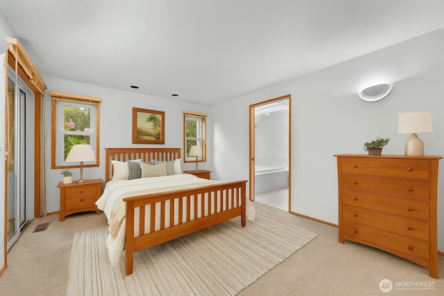 5788 Hannegan Rd, Bellingham, WA 98226 - bedroom featuring light colored carpet, multiple windows, and ensuite bathroom
