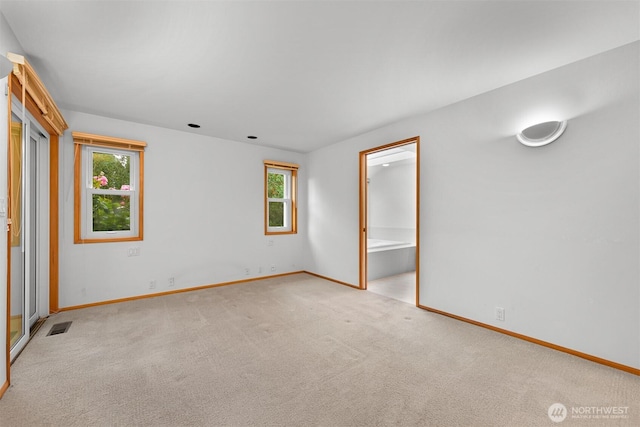 5788 Hannegan Rd, Bellingham, WA 98226 - unfurnished bedroom featuring multiple windows, carpet, and ensuite bathroom