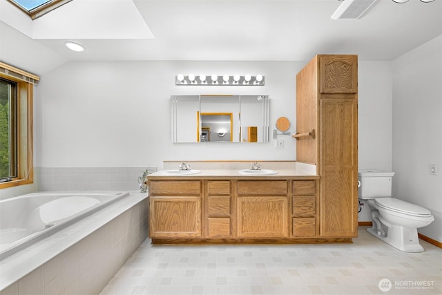 5788 Hannegan Rd, Bellingham, WA 98226 - bathroom featuring a skylight, a garden tub, and double vanity