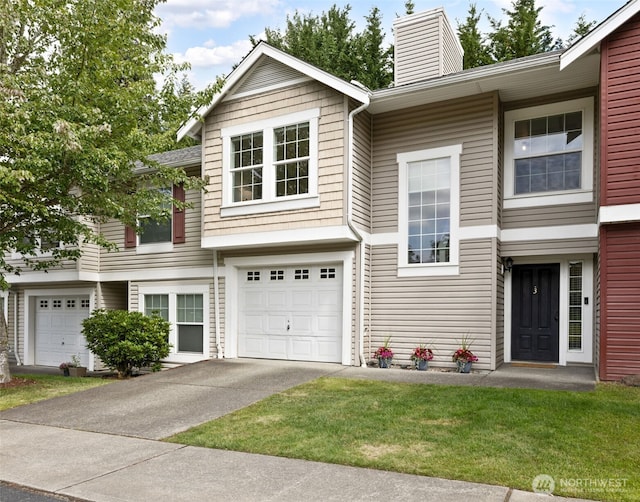 10307 140th Street Ct E Unit 3, Puyallup, WA 98374 - view of front facade featuring an attached garage, a chimney, concrete driveway, and a front yard
