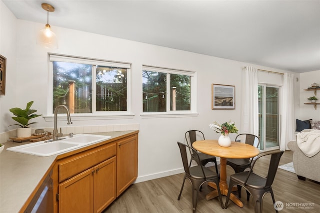 10307 140th Street Ct E Unit 3, Puyallup, WA 98374 - dining space featuring light wood finished floors and baseboards