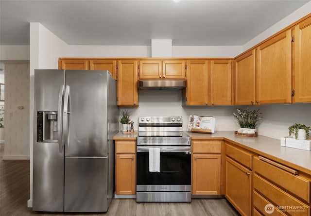 10307 140th Street Ct E Unit 3, Puyallup, WA 98374 - kitchen with stainless steel appliances, under cabinet range hood, light wood finished floors, and light countertops