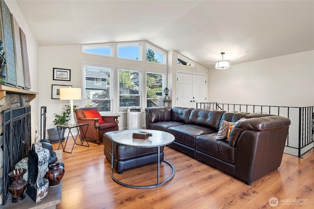 32867 42nd Pl SW, Federal Way, WA 98023 - living area with vaulted ceiling, a fireplace, and light wood-style floors
