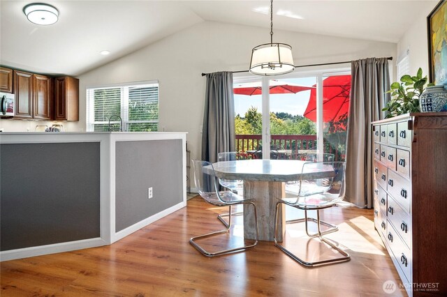32867 42nd Pl SW, Federal Way, WA 98023 - dining area with vaulted ceiling and light wood-style floors