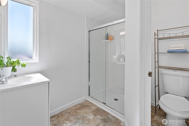 32867 42nd Pl SW, Federal Way, WA 98023 - bathroom featuring a shower stall, stone finish floors, and vanity