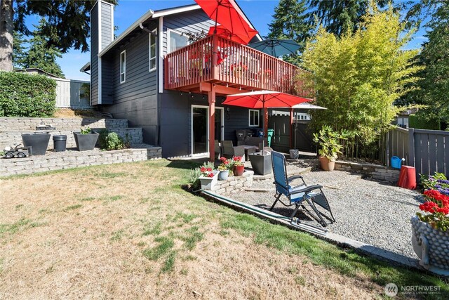32867 42nd Pl SW, Federal Way, WA 98023 - rear view of house featuring a wooden deck, a patio area, and a chimney