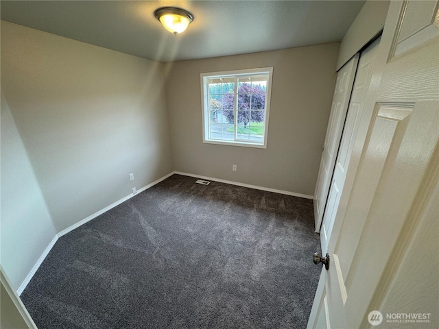 20116 85th Avenue Ct E, Spanaway, WA 98387 - unfurnished bedroom featuring dark colored carpet and a closet