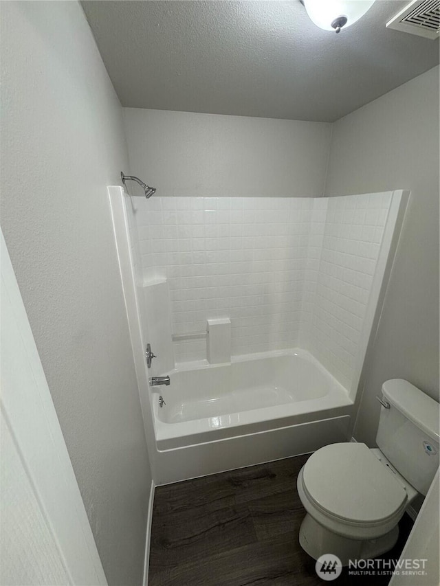 20116 85th Avenue Ct E, Spanaway, WA 98387 - full bath with wood finished floors, shower / tub combination, and a textured ceiling