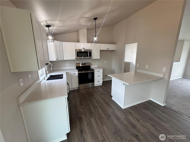 20116 85th Avenue Ct E, Spanaway, WA 98387 - kitchen with stainless steel appliances, hanging light fixtures, white cabinets, dark wood-style flooring, and high vaulted ceiling