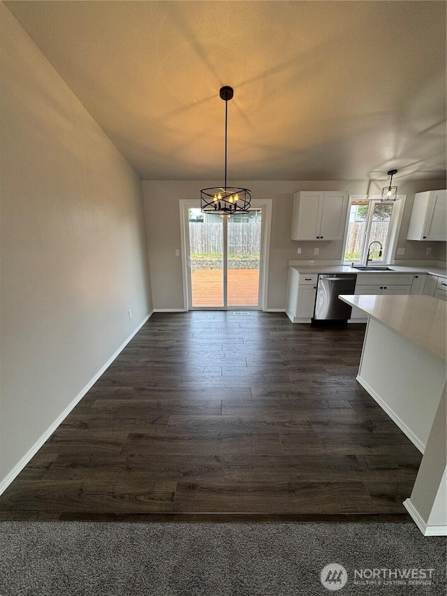 20116 85th Avenue Ct E, Spanaway, WA 98387 - unfurnished dining area featuring a chandelier, dark wood finished floors, and vaulted ceiling