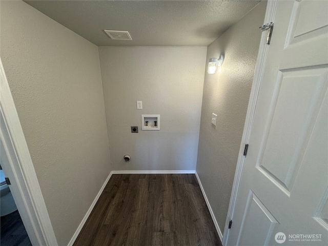 20116 85th Avenue Ct E, Spanaway, WA 98387 - laundry room with hookup for an electric dryer, hookup for a washing machine, dark wood-style floors, a textured wall, and a textured ceiling