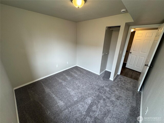 20116 85th Avenue Ct E, Spanaway, WA 98387 - unfurnished bedroom featuring dark carpet and a closet