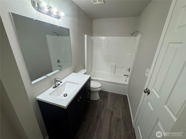 20116 85th Avenue Ct E, Spanaway, WA 98387 - bathroom featuring wood finished floors, vanity, and bathing tub / shower combination