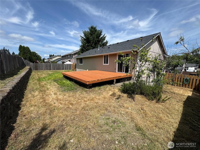 20116 85th Avenue Ct E, Spanaway, WA 98387 - rear view of house with a fenced backyard and a wooden deck