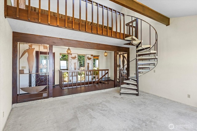 1125 Vista Pl, Edmonds, WA 98020 - stairs featuring carpet flooring, beam ceiling, and a high ceiling