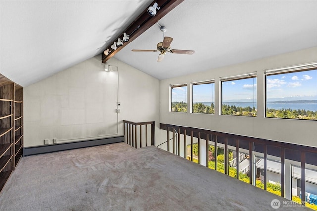 1125 Vista Pl, Edmonds, WA 98020 - spare room featuring a baseboard heating unit, ceiling fan, carpet, and a water view