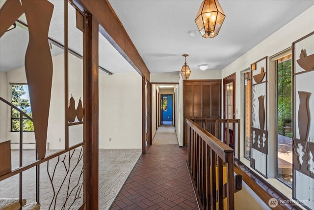 1125 Vista Pl, Edmonds, WA 98020 - hallway featuring brick patterned flooring, plenty of natural light, an upstairs landing, and baseboard heating