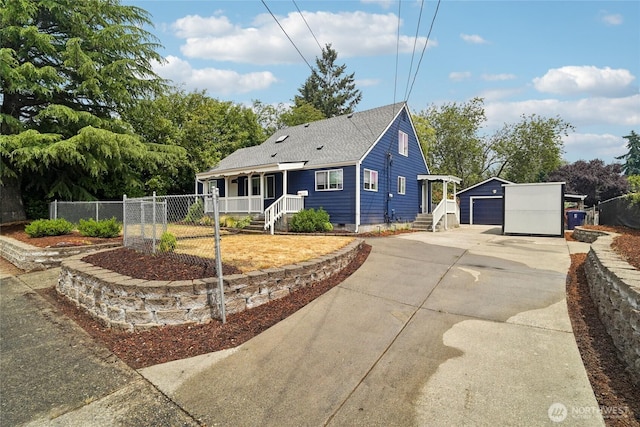 6817 S D St, Tacoma, WA 98408 - view of front facade featuring an outdoor structure, driveway, a garage, a porch, and roof with shingles
