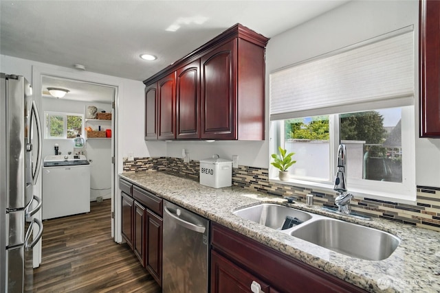6817 S D St, Tacoma, WA 98408 - kitchen featuring stainless steel appliances, washer / clothes dryer, reddish brown cabinets, backsplash, and dark wood-type flooring
