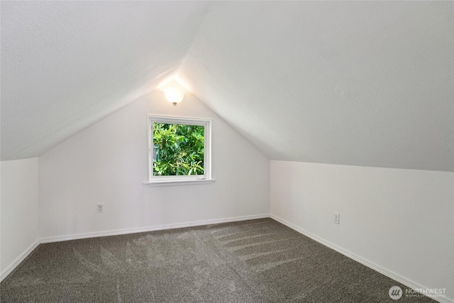 6817 S D St, Tacoma, WA 98408 - additional living space with dark carpet and vaulted ceiling