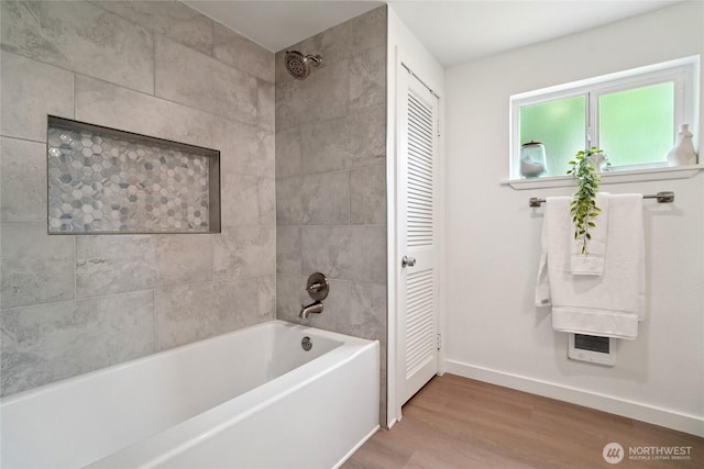 6817 S D St, Tacoma, WA 98408 - full bath featuring wood finished floors, tub / shower combination, and a closet