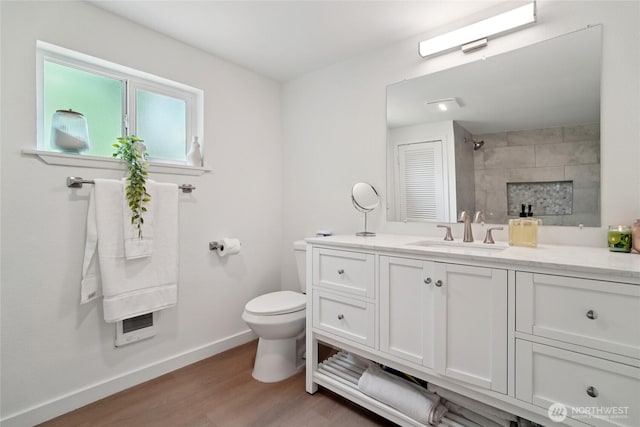 6817 S D St, Tacoma, WA 98408 - bathroom with wood finished floors, vanity, and a shower