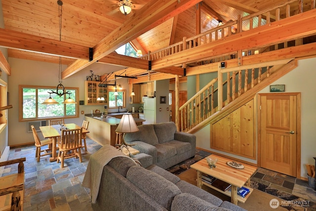 7905 Mountain Home Rd, Leavenworth, WA 98826 - living area with stone tile floors, stairs, and wooden ceiling