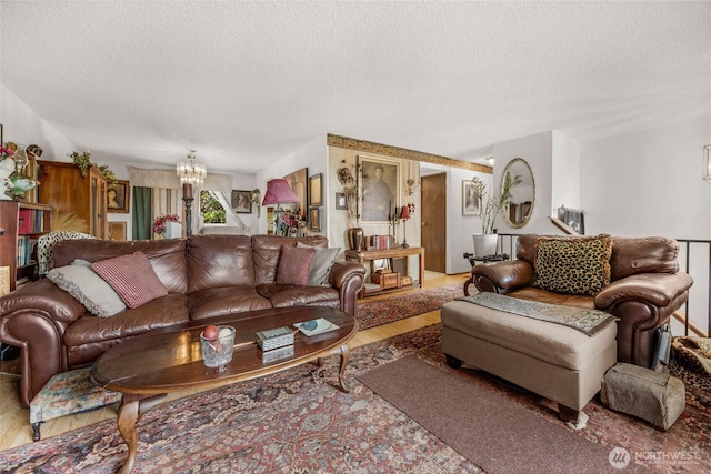 7416 E Heather Way, Everett, WA 98203 - living area with a textured ceiling, a chandelier, and wood finished floors