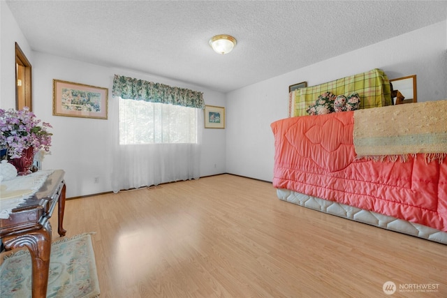 7416 E Heather Way, Everett, WA 98203 - sitting room with wood finished floors and a textured ceiling
