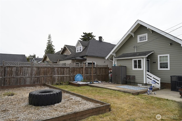 401 Emerson Ave, Hoquiam, WA 98550 - rear view of property featuring an outdoor fire pit