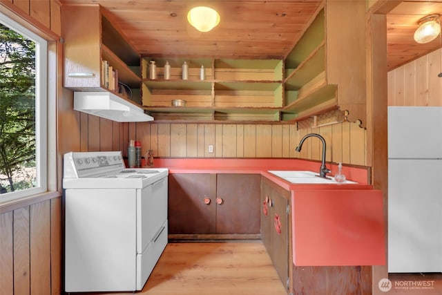 12319 744th Ave NE, Skykomish, WA 98288 - laundry area with wooden walls, washer / clothes dryer, light wood-style flooring, and wood ceiling