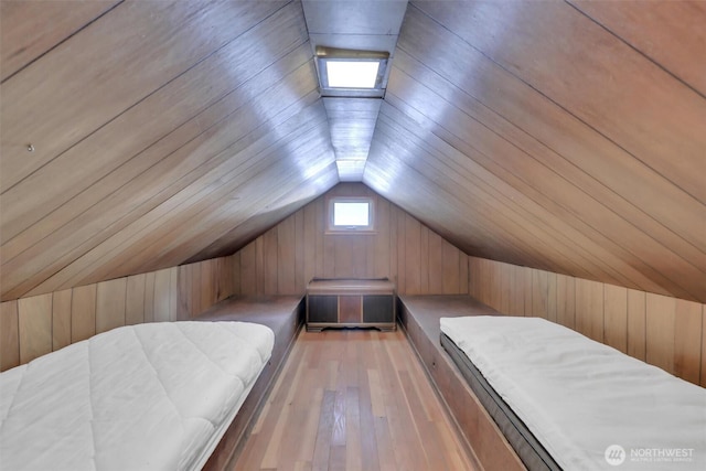 12319 744th Ave NE, Skykomish, WA 98288 - bedroom with a sauna / steam room, wood walls, light wood-style floors, and vaulted ceiling