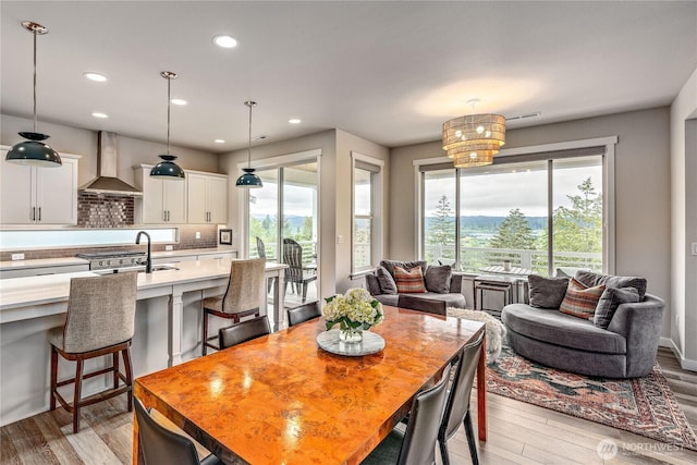1995 NW Rustling Fir Ln, Silverdale, WA 98383 - dining room with plenty of natural light, light wood-style floors, and recessed lighting