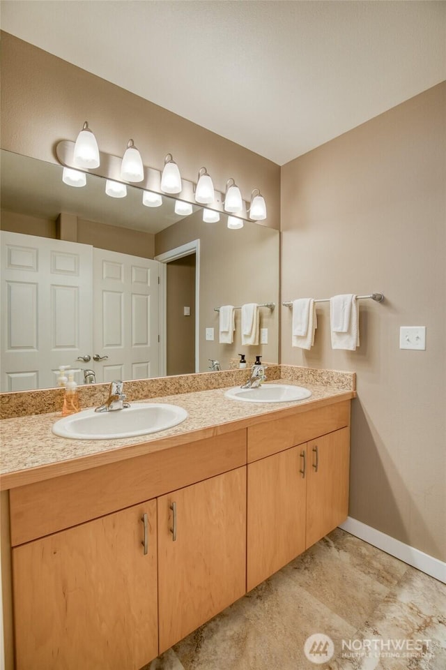 262 Oyhut Bay Blvd SW Unit 204, Ocean Shores, WA 98569 - full bathroom featuring double vanity and baseboards