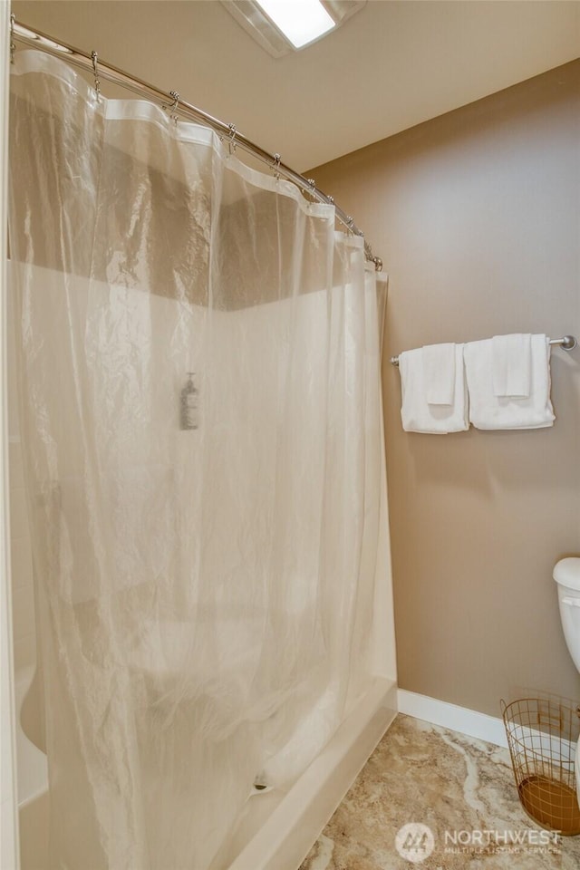 262 Oyhut Bay Blvd SW Unit 204, Ocean Shores, WA 98569 - bathroom with shower / bath combination with curtain and baseboards