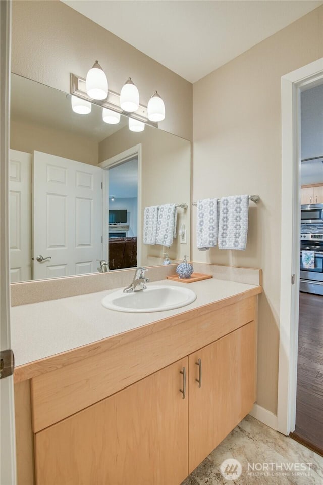 262 Oyhut Bay Blvd SW Unit 204, Ocean Shores, WA 98569 - bathroom featuring vanity and baseboards