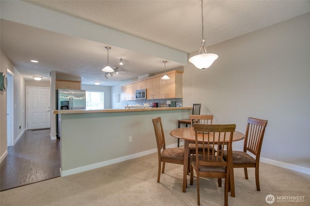 262 Oyhut Bay Blvd SW Unit 204, Ocean Shores, WA 98569 - dining space with baseboards and light carpet