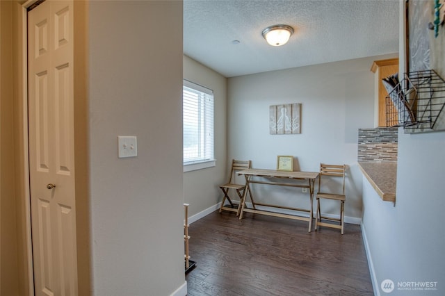 262 Oyhut Bay Blvd SW Unit 204, Ocean Shores, WA 98569 - hallway with dark wood-style floors and a textured ceiling
