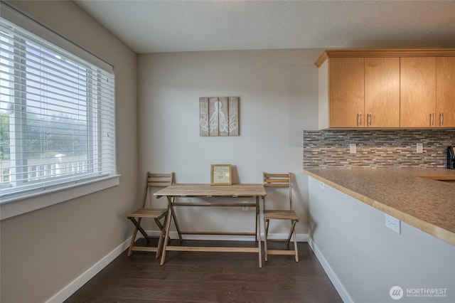 262 Oyhut Bay Blvd SW Unit 204, Ocean Shores, WA 98569 - dining space with healthy amount of natural light and dark wood-style flooring