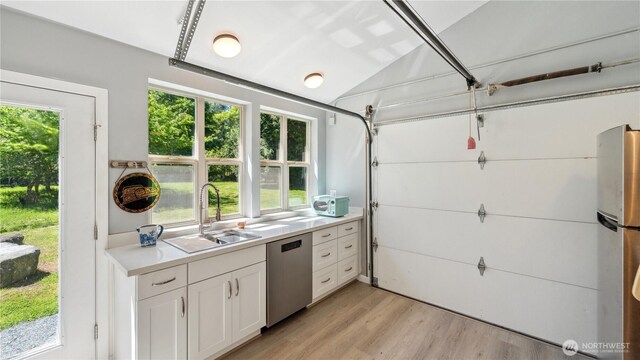 5513 Homestead Ln, Anacortes, WA 98221 - garage featuring freestanding refrigerator and washer / clothes dryer
