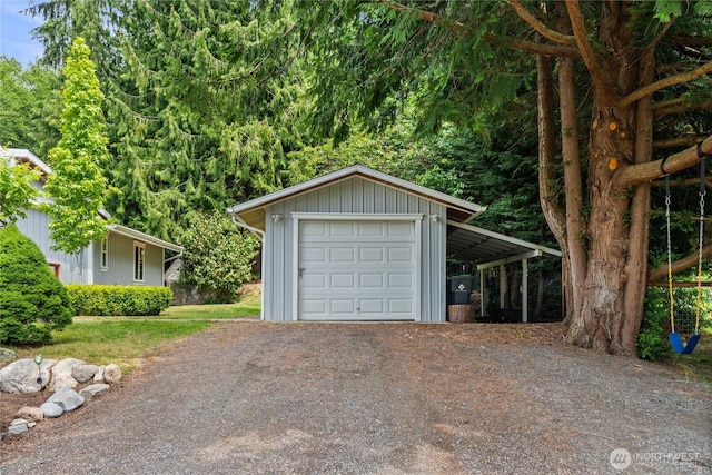 3555 S Holmes View Dr, Langley, WA 98260 - garage featuring dirt driveway and a garage