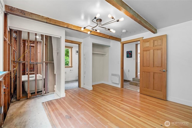 3555 S Holmes View Dr, Langley, WA 98260 - unfurnished bedroom with a chandelier and beamed ceiling