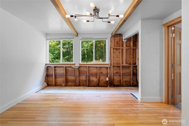 3555 S Holmes View Dr, Langley, WA 98260 - spare room with a chandelier, beamed ceiling, and wood finished floors