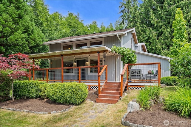3555 S Holmes View Dr, Langley, WA 98260 - view of front facade with a deck