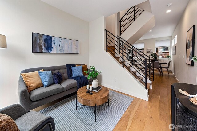 823 Warren Ave N, Seattle, WA 98109 - living area with stairs, wood finished floors, and recessed lighting