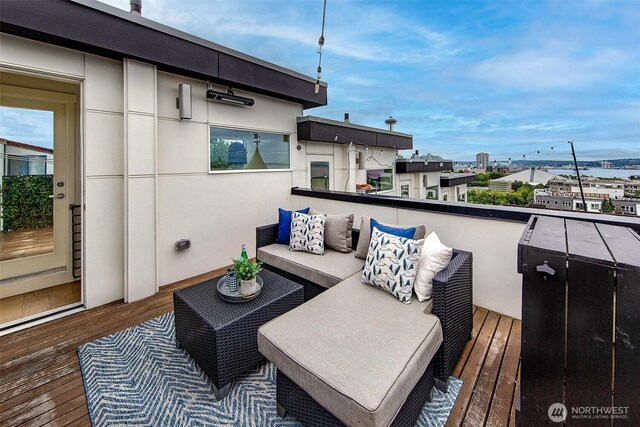 823 Warren Ave N, Seattle, WA 98109 - wooden terrace with an outdoor hangout area