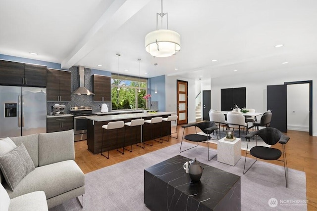 7528 21st Ave SW, Seattle, WA 98106 - living room featuring light wood-type flooring, recessed lighting, and beam ceiling