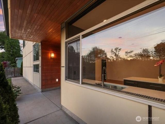 7528 21st Ave SW, Seattle, WA 98106 - patio terrace at dusk featuring a sink and a patio