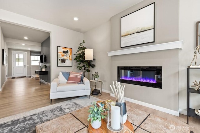 11433 SE 84th St Unit 41, Newcastle, WA 98056 - living room with wood finished floors, a glass covered fireplace, and recessed lighting