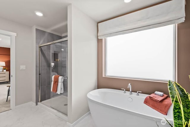 11433 SE 84th St Unit 41, Newcastle, WA 98056 - bathroom with a freestanding bath, a stall shower, marble look tiles, and recessed lighting
